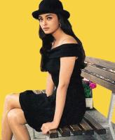 Aishwarya Rai in black and wearing a hat